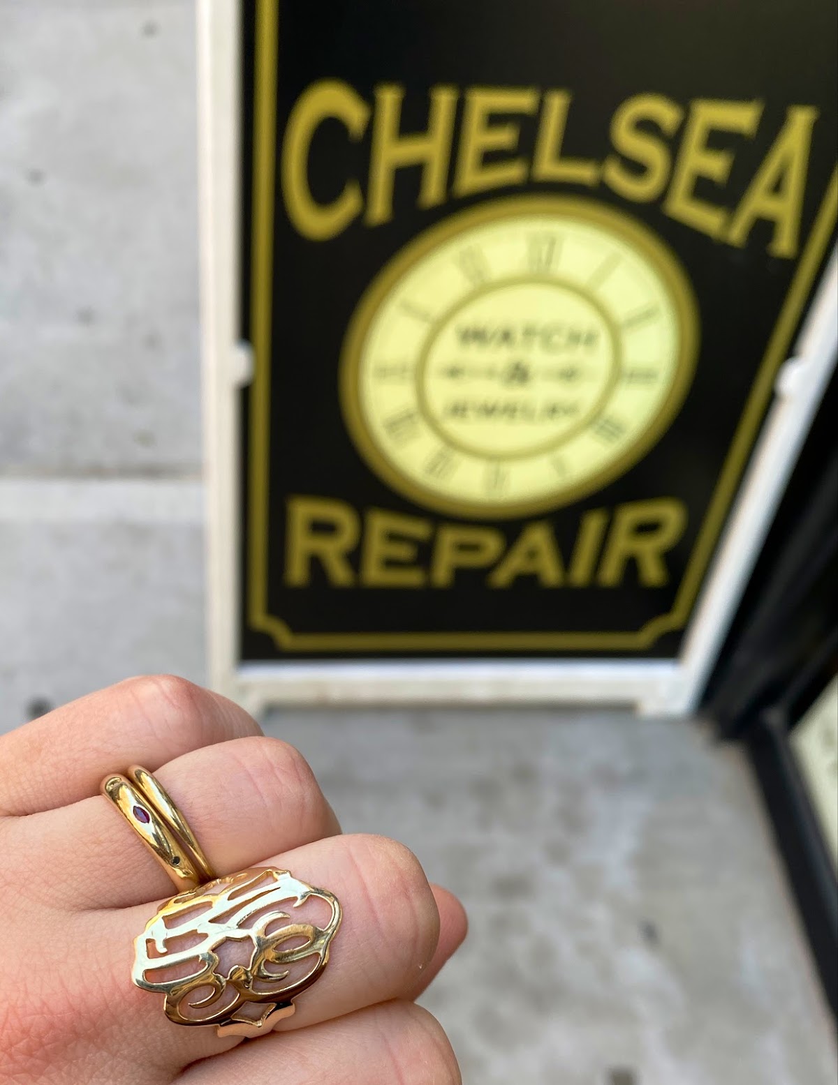 Gold rings under the workshop sign
